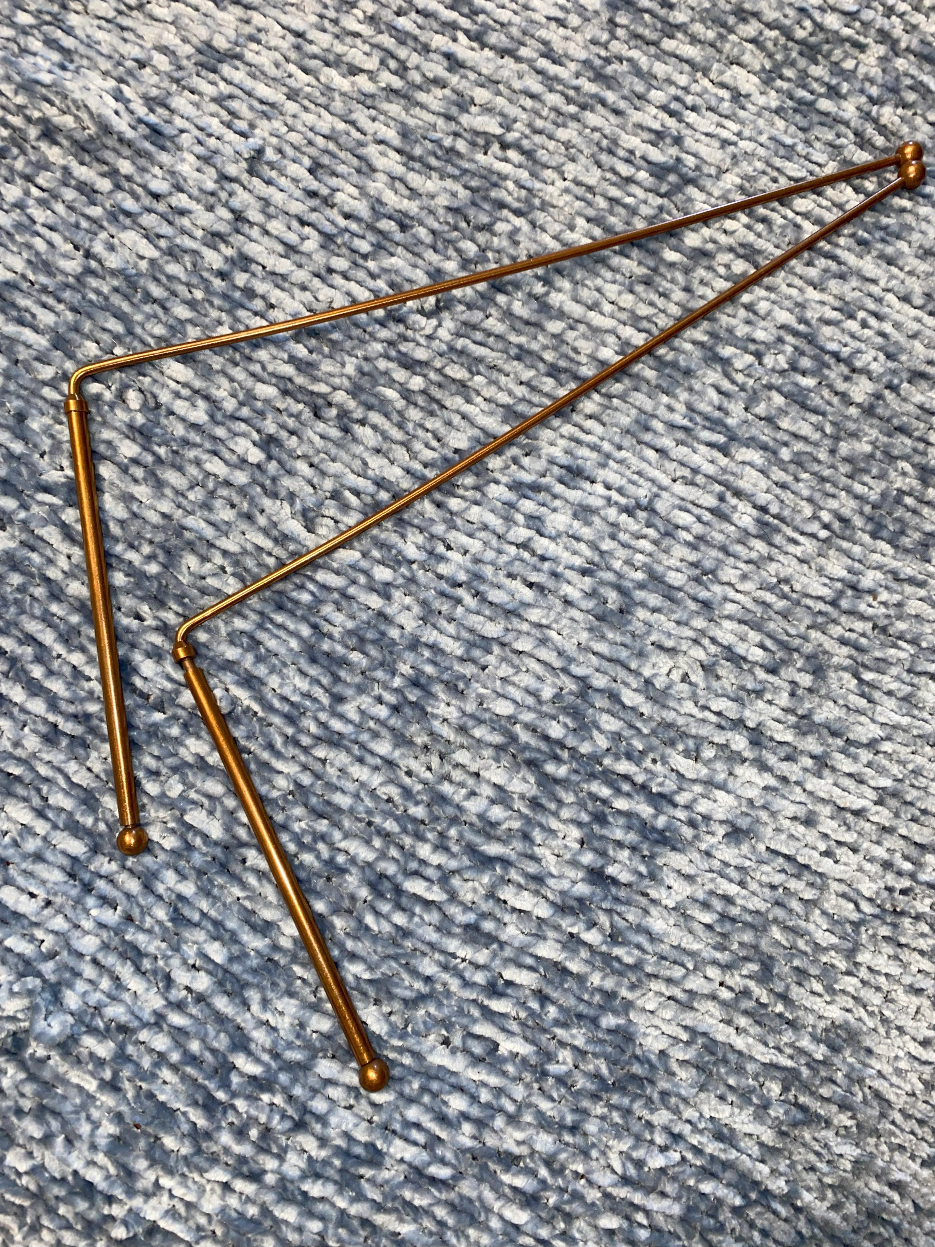 Gold metal copper rod on a textured blue surface