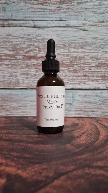 Bottle of Men's Privy Oil with dropper on a wooden surface